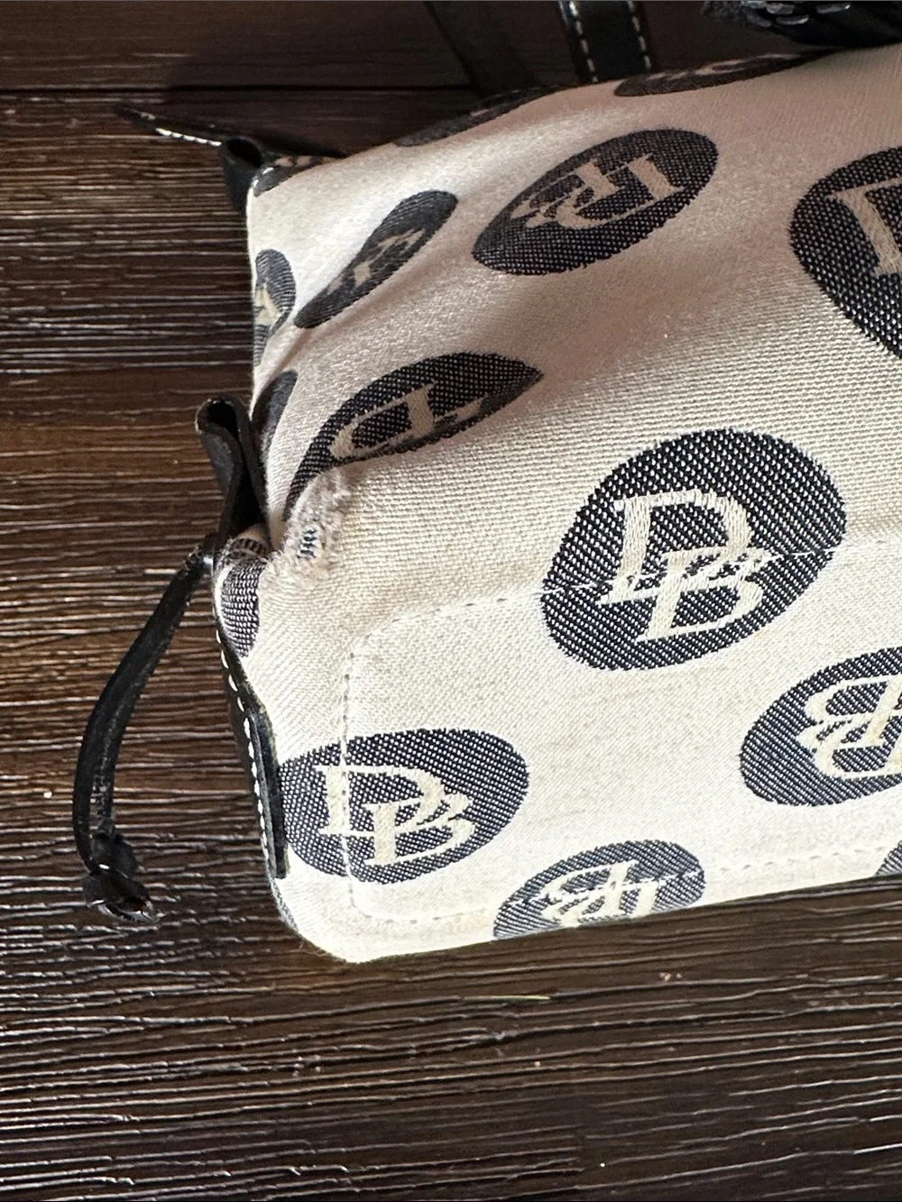 Dooney & Bourke Vintage logo jacquard handbag in cream and black.